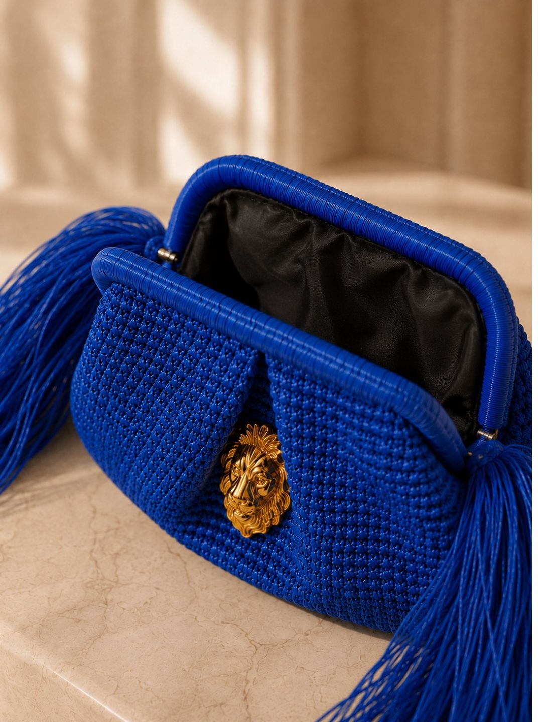 The Kimo Fringe Clutch
